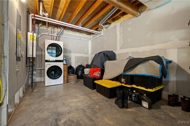 1392 Big Moose Rd, Webb, NY 13331 - unfinished basement with stacked washing machine and dryer