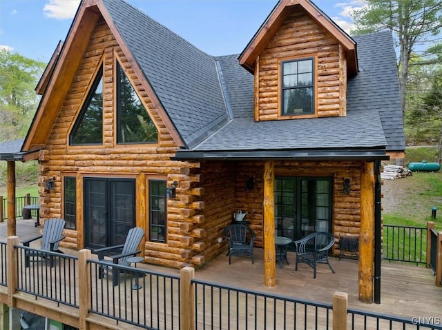 1392 Big Moose Rd, Webb, NY 13331 - rear view of property with log siding, a shingled roof, french doors, and a wooden deck