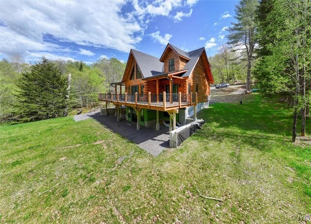 1392 Big Moose Rd, Webb, NY 13331 - rear view of property with a wooden deck, log exterior, a yard, and a patio