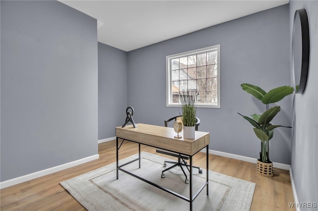 office featuring baseboards and wood finished floors