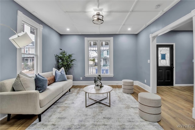 living room featuring a wealth of natural light, recessed lighting, baseboards, and wood finished floors