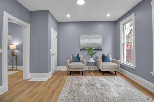 sitting room with recessed lighting, wood finished floors, and baseboards