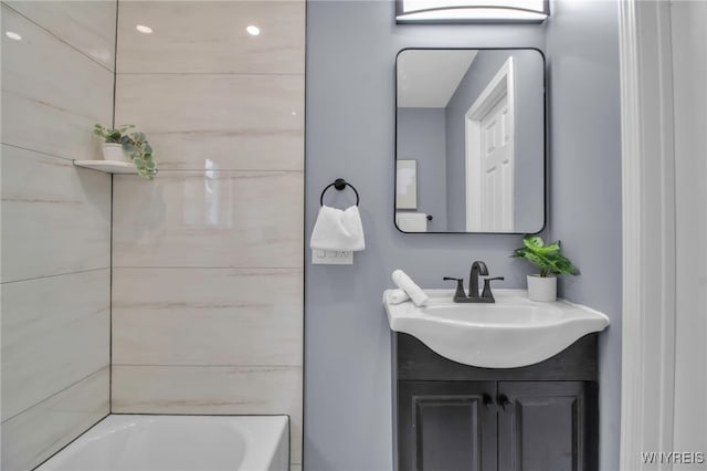 bathroom featuring vanity and shower / bath combination