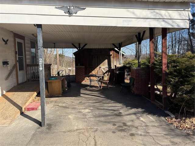 view of patio / terrace with an attached carport