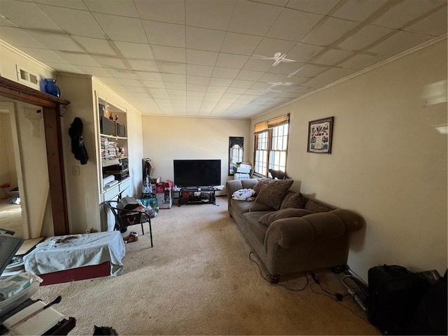 living room with carpet, visible vents, and ornamental molding