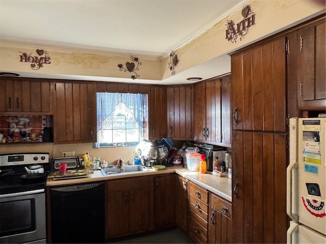 kitchen with stainless steel electric stove, light countertops, black dishwasher, freestanding refrigerator, and a sink