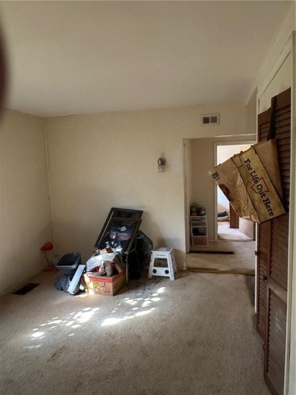 interior space with visible vents and carpet floors