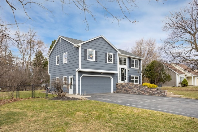 view of front facade with aphalt driveway, an attached garage, a front lawn, and fence