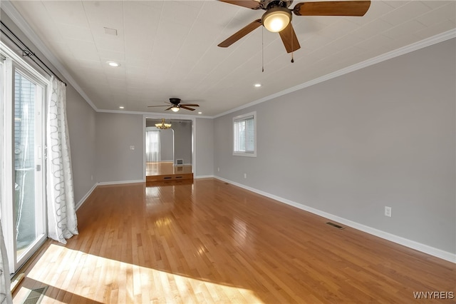 empty room with baseboards, light wood finished floors, recessed lighting, ceiling fan, and crown molding