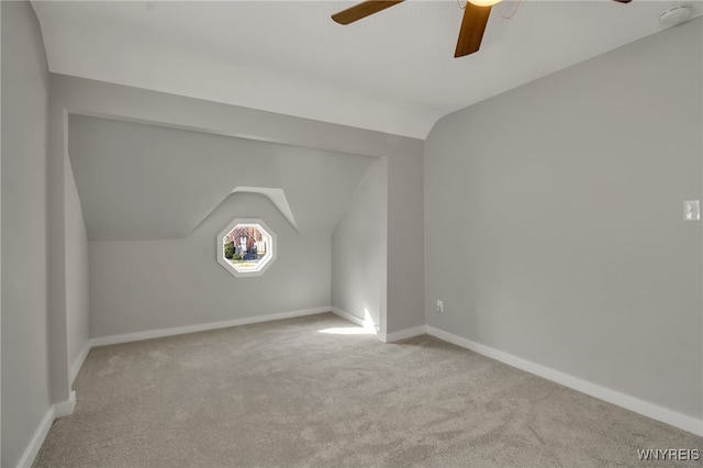 bonus room featuring baseboards, carpet, a ceiling fan, and vaulted ceiling