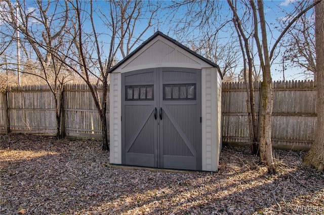 view of shed featuring a fenced backyard