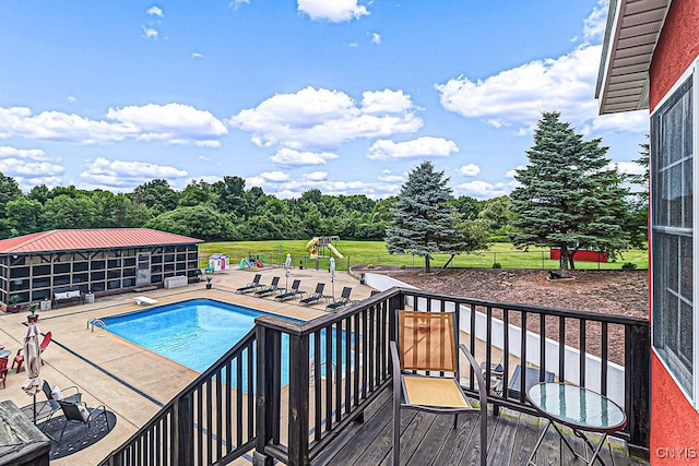 outdoor pool featuring a patio