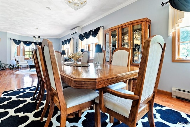 dining area featuring a wall mounted air conditioner, ornamental molding, a baseboard heating unit, wood finished floors, and an inviting chandelier