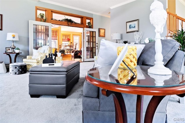living room with carpet flooring, french doors, and ornamental molding