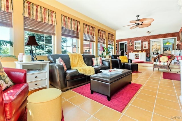 living area featuring tile patterned floors and ceiling fan