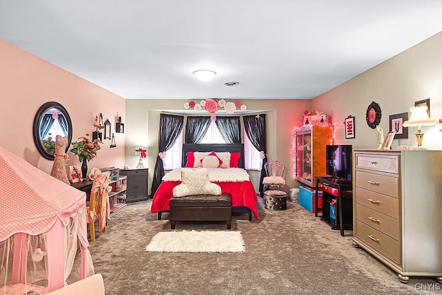 bedroom featuring carpet flooring and visible vents
