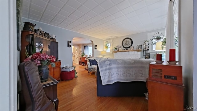 1644 Saint Agnes Ave, Utica, NY 13501 - bedroom with arched walkways and wood finished floors