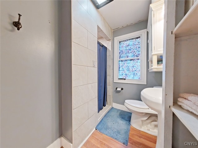 1644 Saint Agnes Ave, Utica, NY 13501 - full bath with toilet, baseboards, a shower with curtain, and wood finished floors