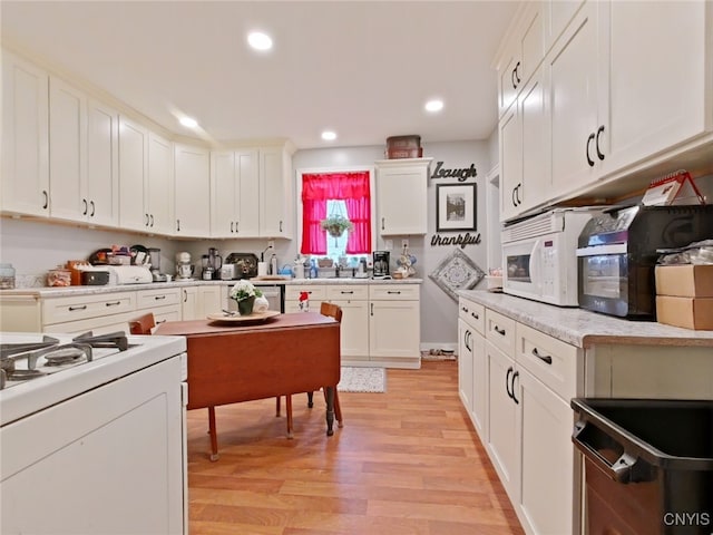 1644 Saint Agnes Ave, Utica, NY 13501 - kitchen with light wood finished floors, white appliances, light countertops, white cabinetry, and recessed lighting