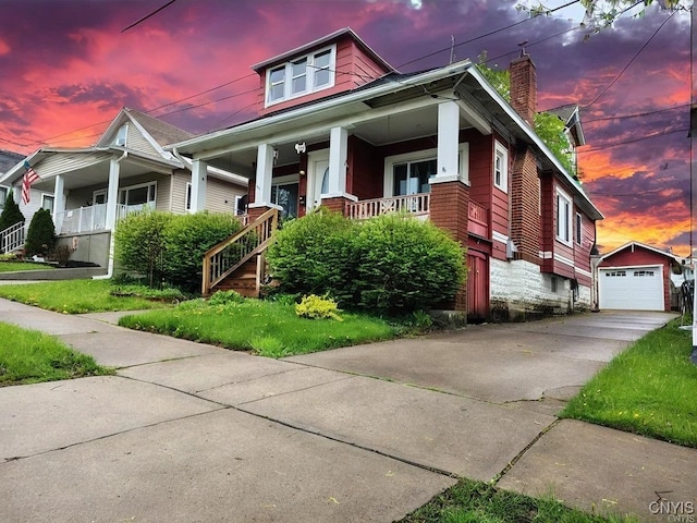 1644 Saint Agnes Ave, Utica, NY 13501 - bungalow with covered porch, a chimney, an outdoor structure, driveway, and a detached garage