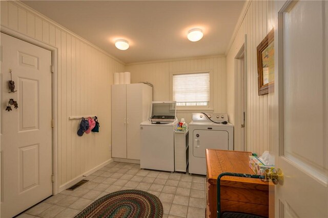 123 Sunset Ridge Rd, Otsego, NY 13326 - laundry room featuring crown molding, washer and clothes dryer, and light tile patterned floors