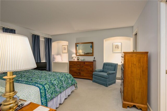 123 Sunset Ridge Rd, Otsego, NY 13326 - bedroom with arched walkways and carpet floors