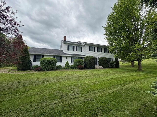 123 Sunset Ridge Rd, Otsego, NY 13326 - view of front of property featuring a chimney and a front yard