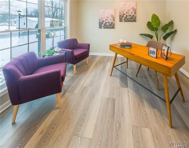 office space featuring light wood finished floors and baseboards