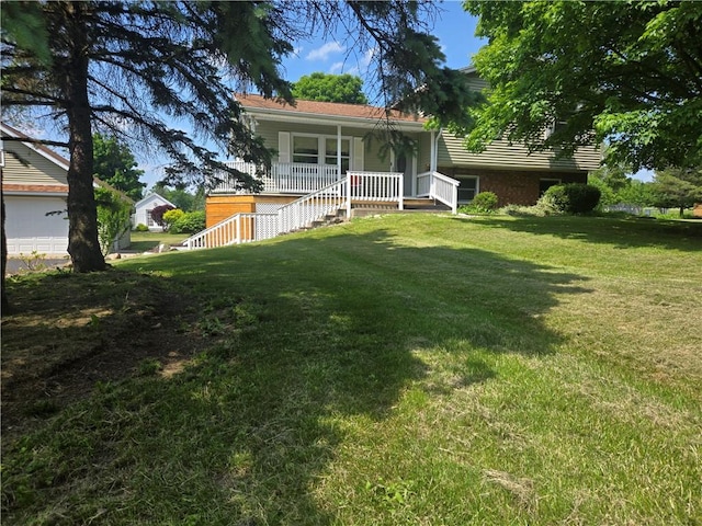 212 Wilson Rd, Lansing, NY 14882 - split level home featuring covered porch and a front lawn