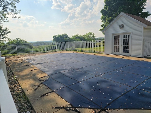 212 Wilson Rd, Lansing, NY 14882 - view of swimming pool featuring french doors and a patio area