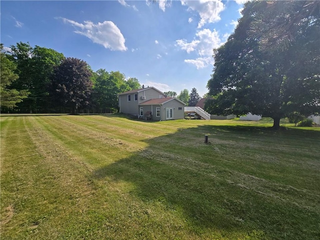 212 Wilson Rd, Lansing, NY 14882 - view of grassy yard with stairway