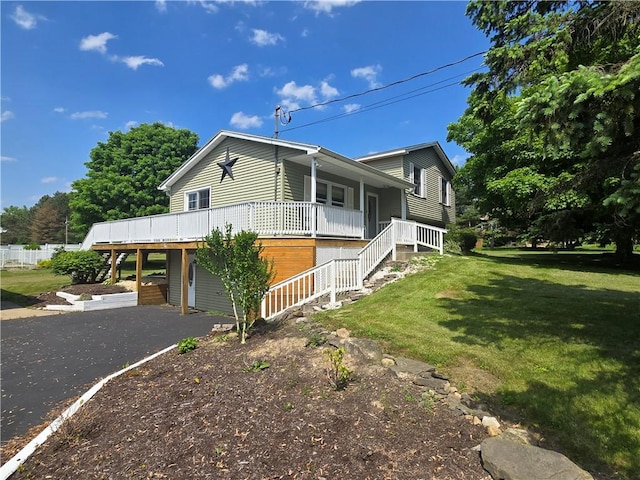 212 Wilson Rd, Lansing, NY 14882 - view of side of home featuring stairs, a yard, a porch, and driveway