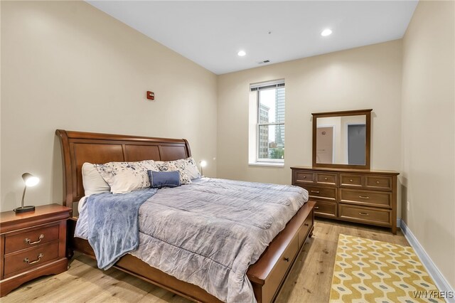 bedroom featuring recessed lighting, visible vents, baseboards, and light wood finished floors