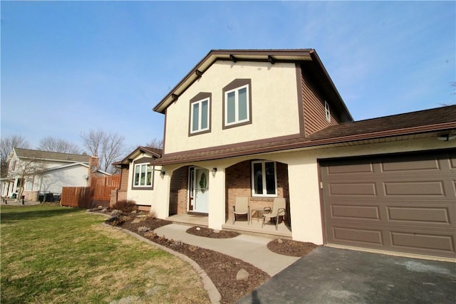 view of front of property with a front lawn, a garage, covered porch, and stucco siding