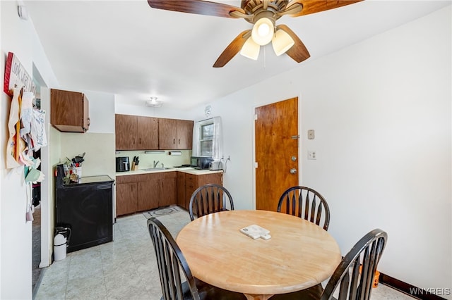 dining room featuring ceiling fan