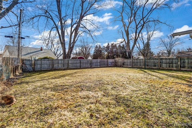 view of yard with a fenced backyard