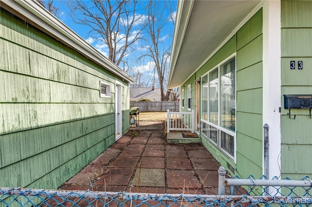 view of patio / terrace featuring fence