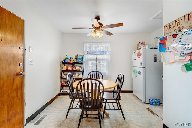 dining room featuring a ceiling fan, visible vents, and baseboards