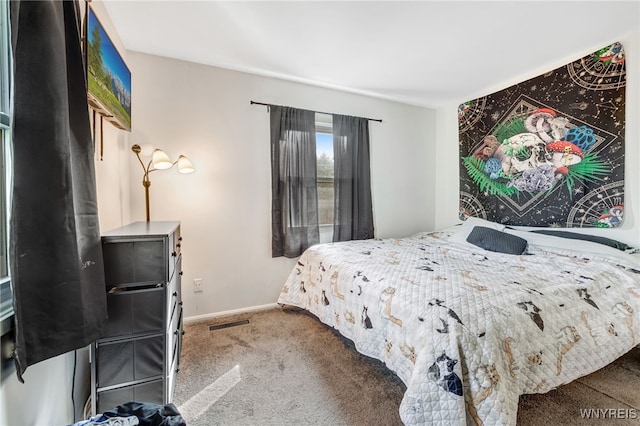 bedroom with carpet, visible vents, and baseboards