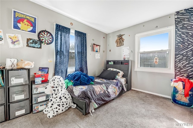 bedroom featuring carpet flooring and baseboards