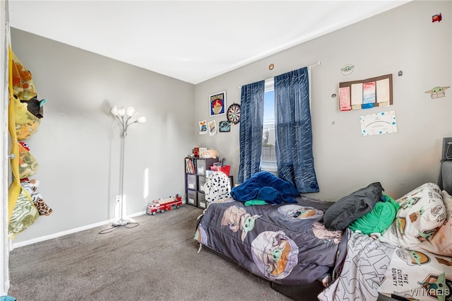 bedroom with baseboards and carpet flooring