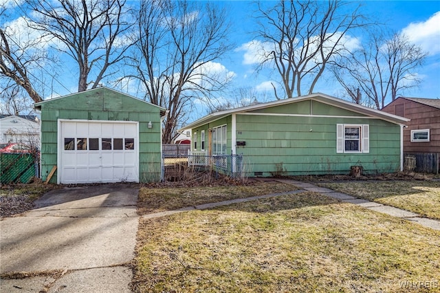 view of side of home featuring a detached garage, fence, crawl space, an outbuilding, and driveway