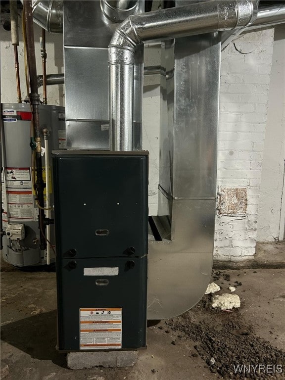 utility room featuring gas water heater