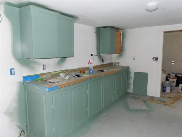 kitchen featuring green cabinetry