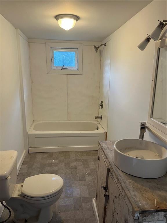 bathroom with vanity, toilet, and washtub / shower combination