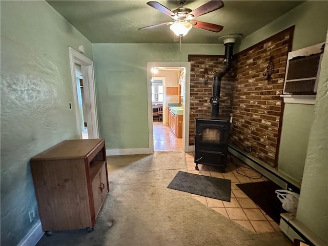 7 Hedgehog Ln, Bradford-Town, PA 16701 - living room with a wood stove, a ceiling fan, baseboards, and tile patterned floors