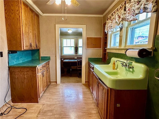 7 Hedgehog Ln, Bradford-Town, PA 16701 - kitchen featuring brown cabinets, wallpapered walls, plenty of natural light, light wood finished floors, and ornamental molding