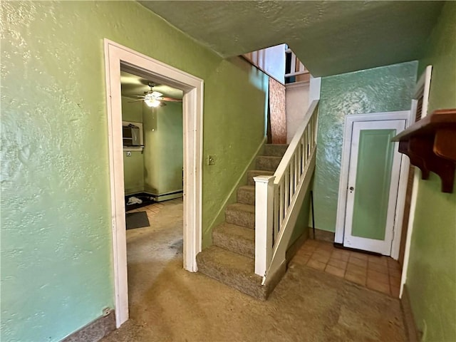 7 Hedgehog Ln, Bradford-Town, PA 16701 - stairway with ceiling fan, a textured wall, carpet flooring, and baseboards
