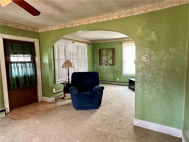 7 Hedgehog Ln, Bradford-Town, PA 16701 - living area with carpet, arched walkways, baseboards, ceiling fan, and baseboard heating