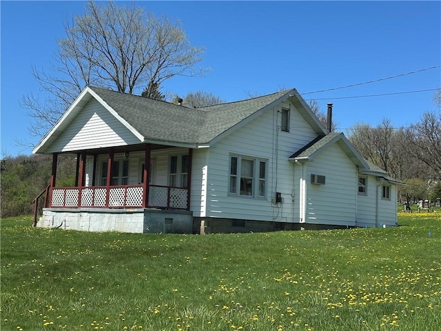 7 Hedgehog Ln, Bradford-Town, PA 16701 - rear view of property featuring covered porch, a shingled roof, and a yard